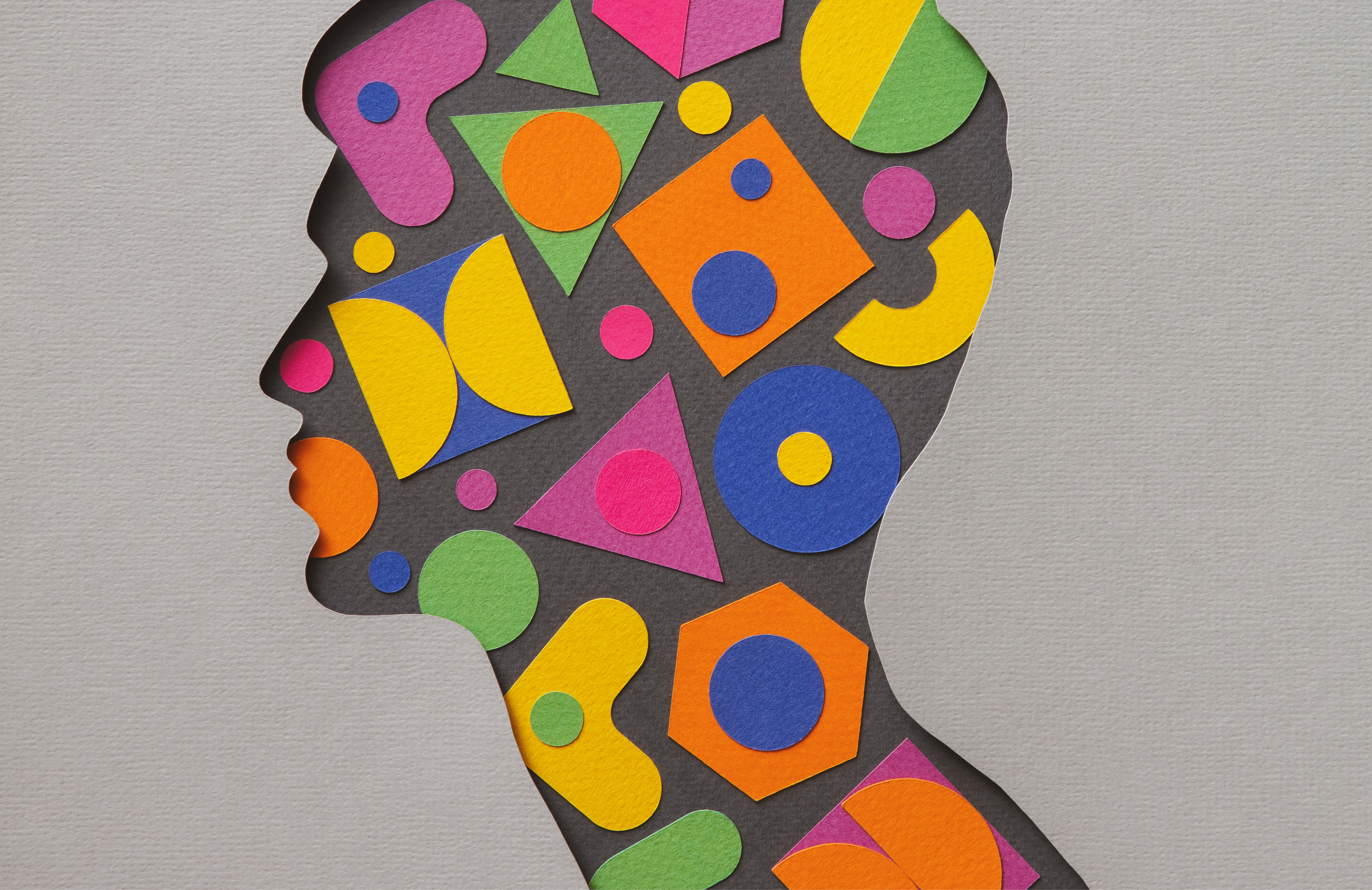 Ilustração artesanal de papel de um jovem cheio de formas geométricas multicoloridas