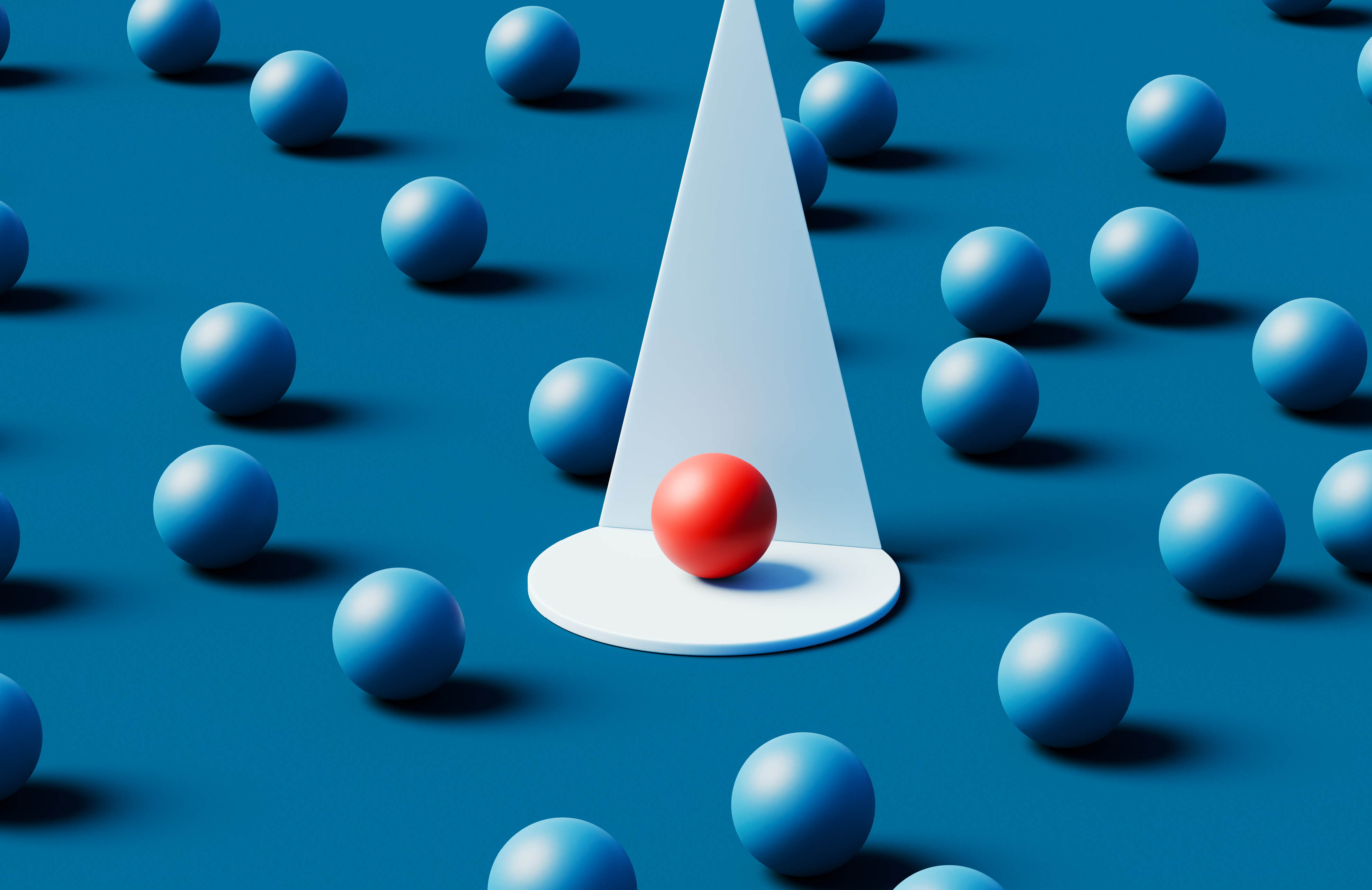 Imagem conceitual em 3D de dezenas de esferas idênticas em azul fosco, dispostas em formação perfeita sobre um fundo azul, com uma única esfera vermelha dramaticamente iluminada por um feixe de luz branca.